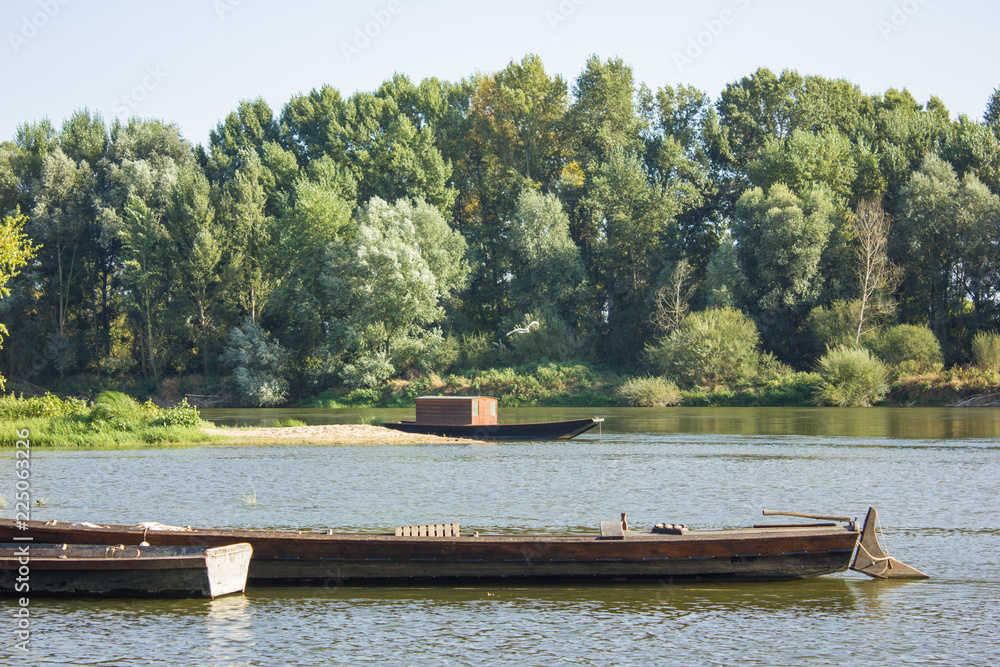 Fototapeta premium wooden boat with sail moored
