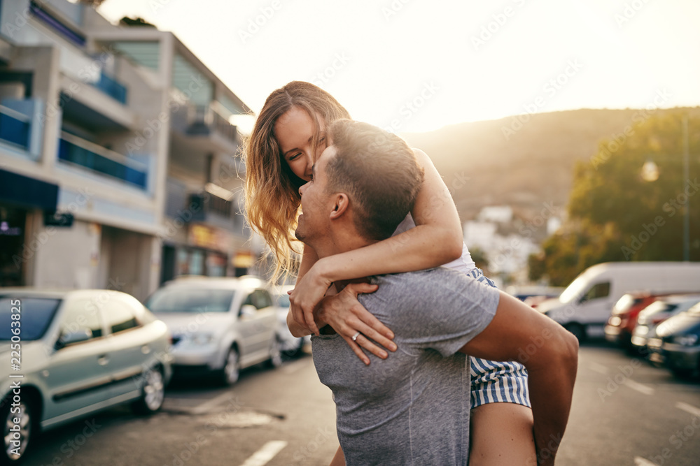 Playful young couple having fun together in the city