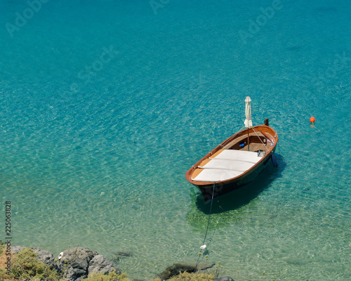 Small wooden boat in the sea