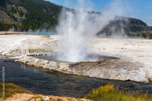 Ejecting fountain of hot water geyser, Yellowstone National Park, USA