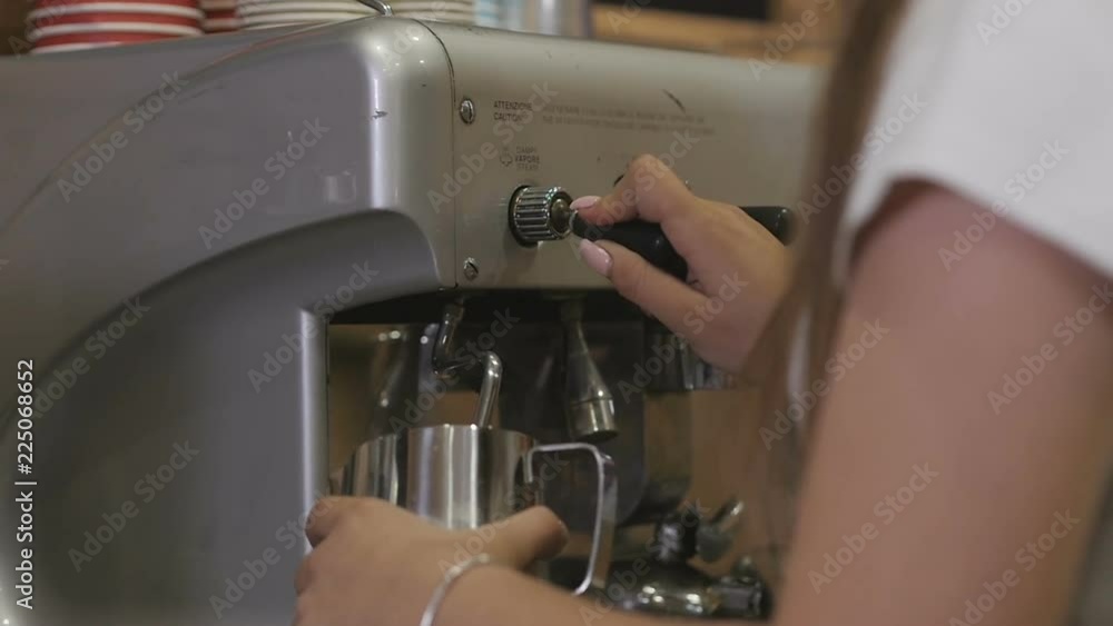 Crop woman frothing milk with machine Crop woman frothing milk with machine
