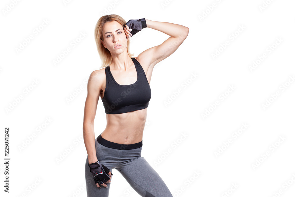 Sporty blonde female in sportswear isolated on white background Sporty blonde female in sportswear isolated on white background