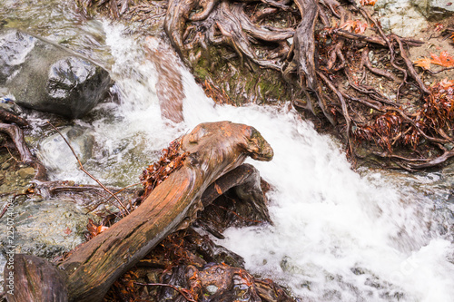 Autumn waterfall with rocks and leaves in Troodos mountains in Cyprus photo