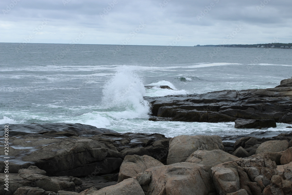 Waves crashing against a breakwater on the Atlantic Ocean in Maine 