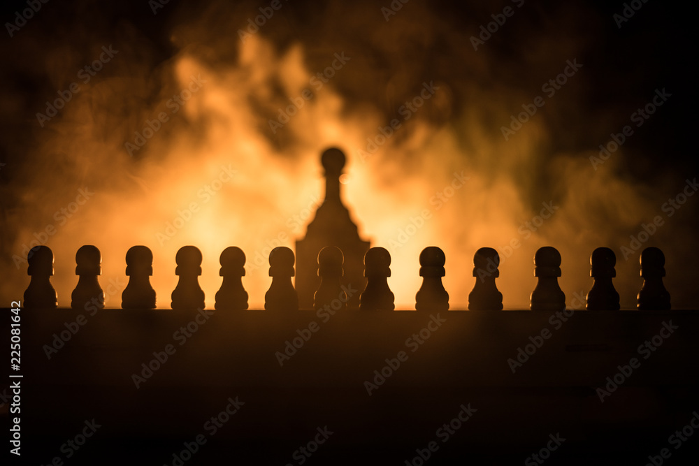 Chess board game concept of business ideas and competition or strategy ideas concept. Chess figures on a dark toned foggy background. Chess board game concept of business ideas and competition or strategy ideas concept. Chess figures on a dark toned foggy background.