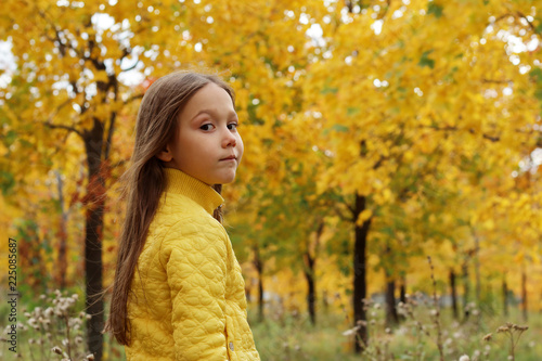 little girl model posing in autumn forest, child playing in Park