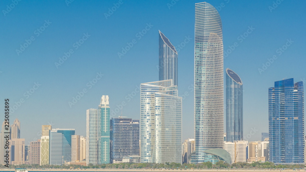 View of high skyscrapers on a corniche in Abu Dhabi stretching alongside the business center timelapse hyperlapse.