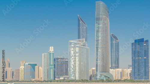 View of high skyscrapers on a corniche in Abu Dhabi stretching alongside the business center timelapse hyperlapse.