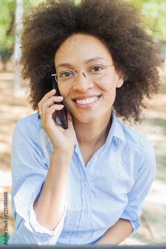 Beautiful Young Afro American Student Woman Speaking With Phone Outdoor