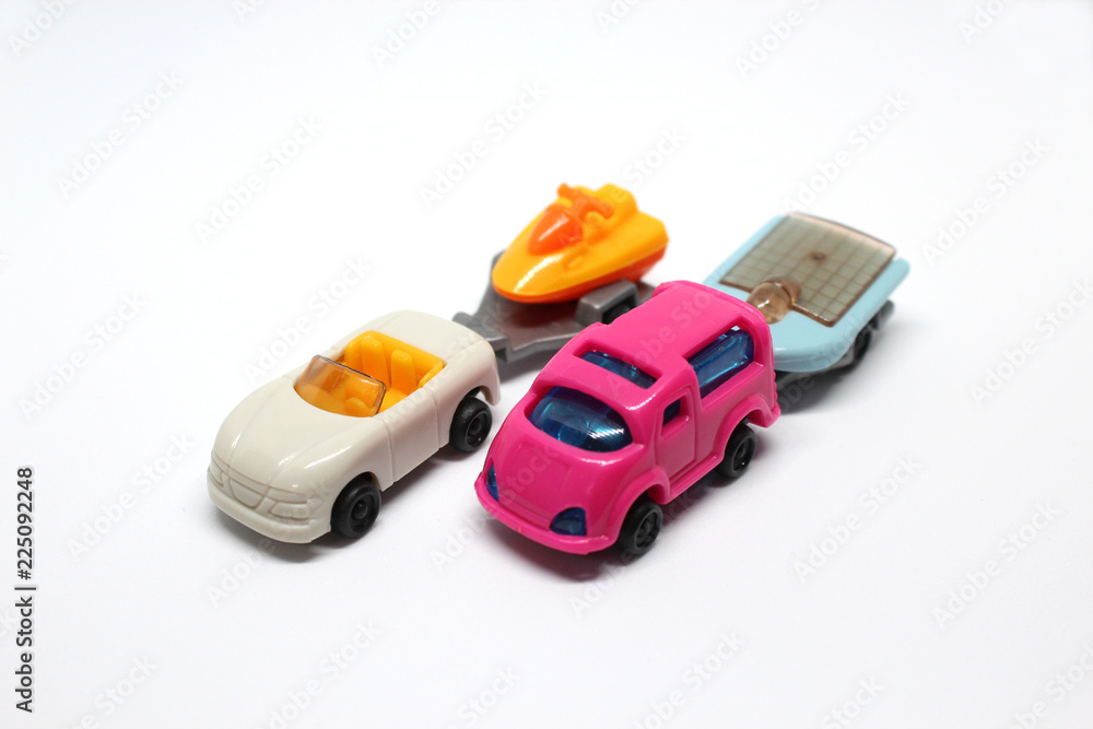 Isolated Pink and White Cars With Trailers Isolated Pink and White Cars With Trailers