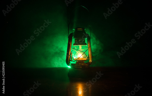 Oil Lamp Lighting up the Darkness or Burning kerosene lamp background, concept lighting. Selective focus © zef art