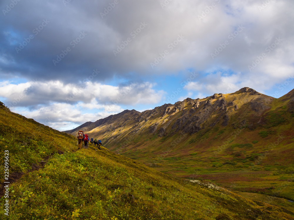 Backpackers on Trail in Alaska During Autumn, Mountains and Valley View