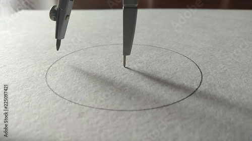 compasses draw a circle on a piece of paper
