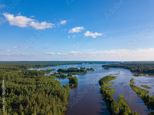 Aerial view of river Nemda with green riverside and islands. Summer 2018, Russia © umike_foto