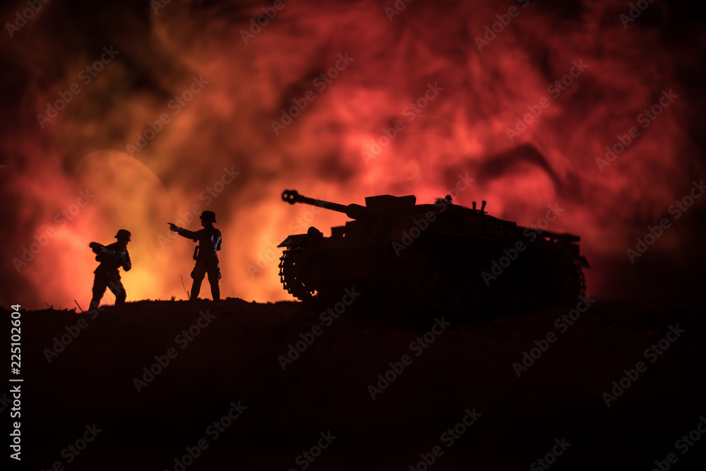 Obraz premium War Concept. Military silhouettes fighting scene on war fog sky background, World War German Tanks Silhouettes Below Cloudy Skyline At night. Attack scene. Armored vehicles.