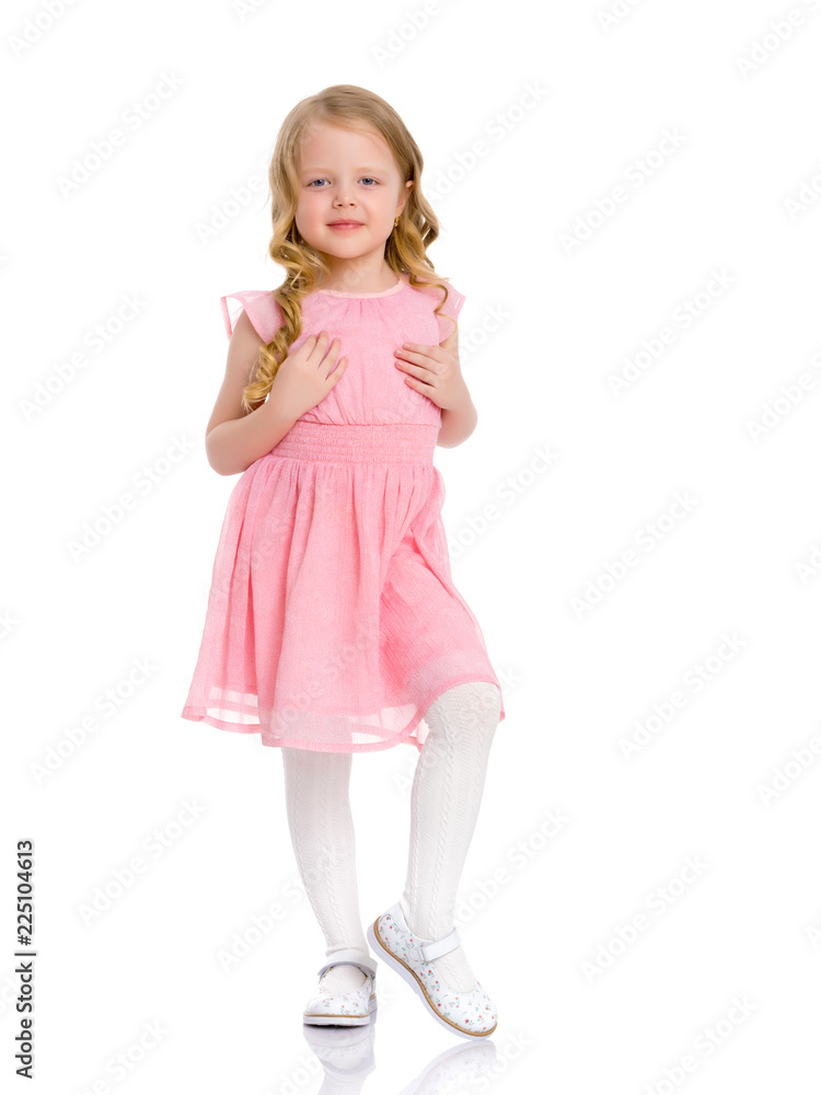 A cheerful little girl is dancing. A cheerful little girl is dancing.