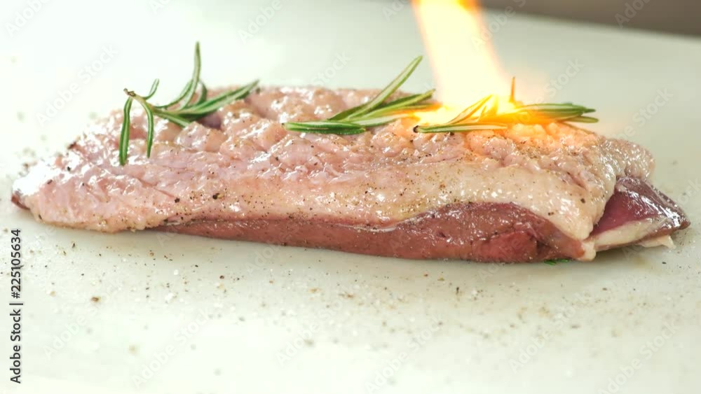 Cooking duck breast, culinary torch. Meat and flame. Cooking duck breast, culinary torch. Meat and flame.