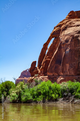 View from the Colorado River of the Jug Handle Arch outside Moab, Utah photo