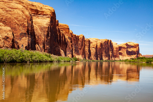 Water view from the Colorado River along the bluffs and rock sculpture outside Moab, Utah © Anne Lindgren