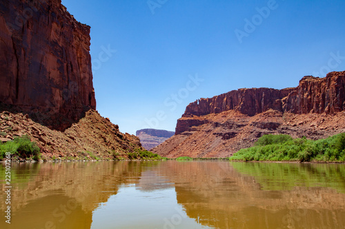 Water view from the Colorado River along the bluffs and rock sculpture outside Moab, Utah © Anne Lindgren