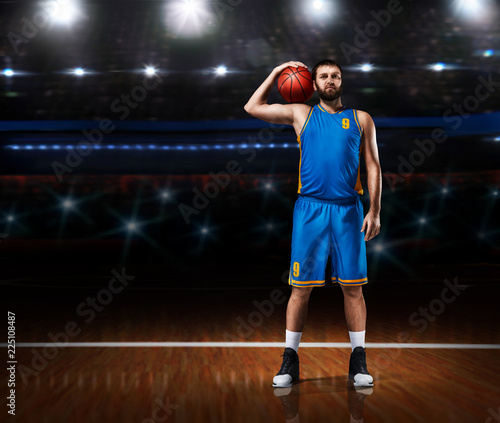 basketball player im blue uniform standing on basketball court © 27mistral