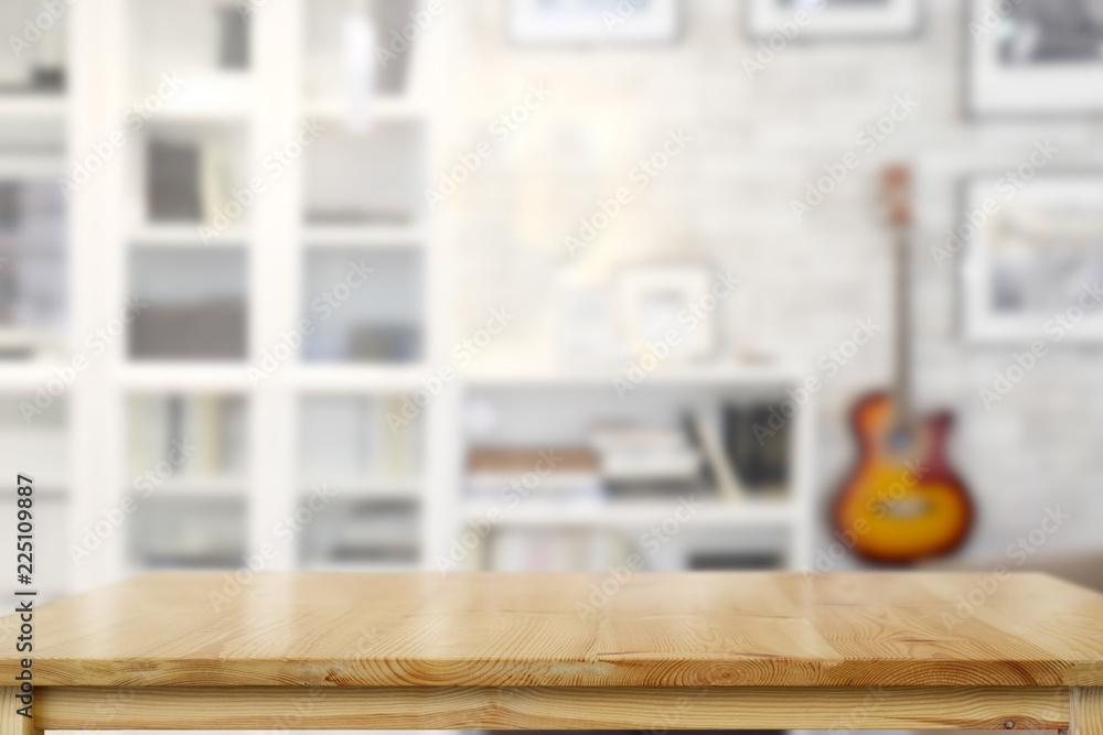 Empty wooden table over living room background. Empty wooden table over living room background.