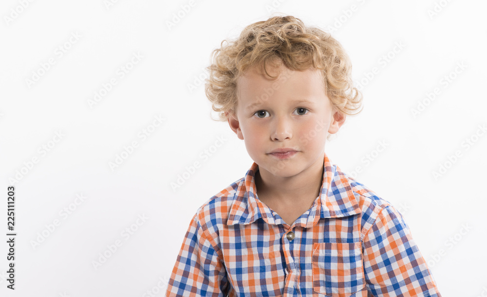 Little boy in plaid shirt with sweet, serious face, isolated on white background Little boy in plaid shirt with sweet, serious face, isolated on white background