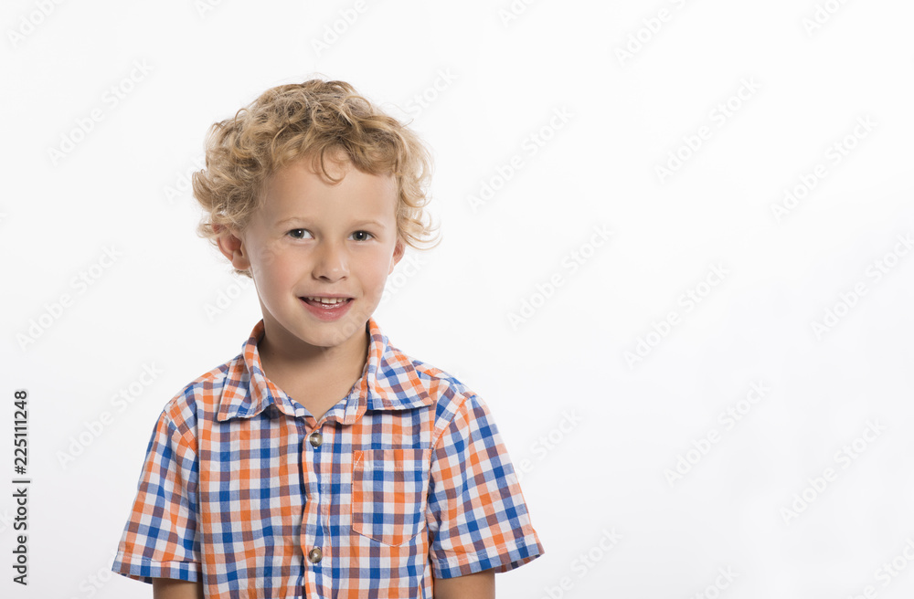 Happy, little, boy with blonde curls smiles at camera, isolated on white background Happy, little, boy with blonde curls smiles at camera, isolated on white background