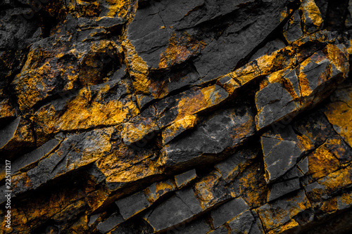 black rock background with gold  / yellow colored rocks