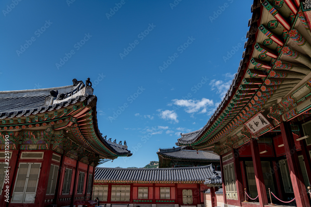 The Korea traditional architecture have a beauty of both colorful and curve under blue and high sky in autumn. Here is Gyeongbokgung Palace where is one of the famous places to tourist who visit Korea The Korea traditional architecture have a beauty of both colorful and curve under blue and high sky in autumn. Here is Gyeongbokgung Palace where is one of the famous places to tourist who visit Korea