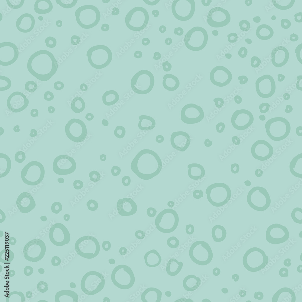 Seamless repeat pattern of blue circles on a light mint background