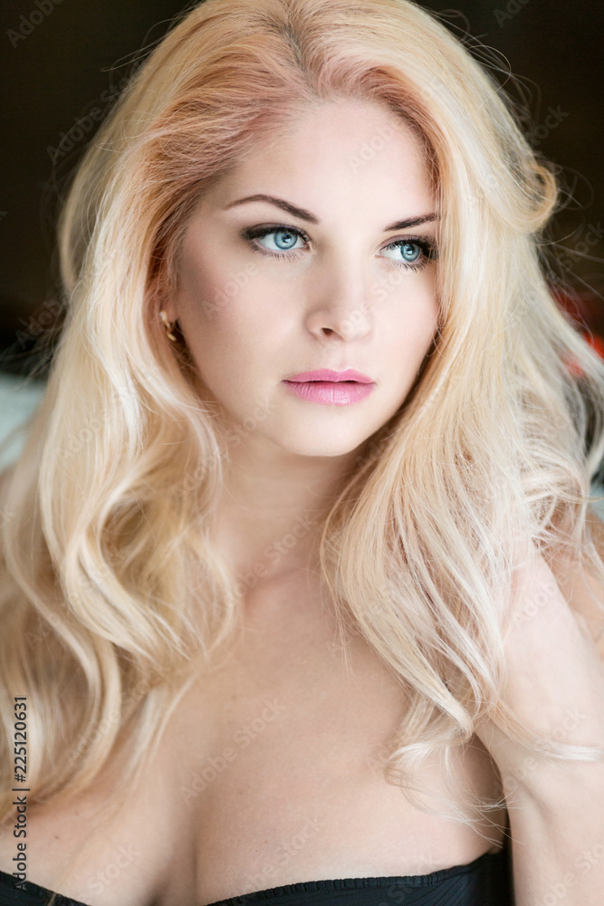 Bright blonde with beautiful blue eyes, close-up Bright blonde with beautiful blue eyes, close-up