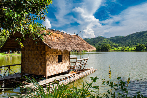 The wooden raft in the water reservoirs and mountain views.