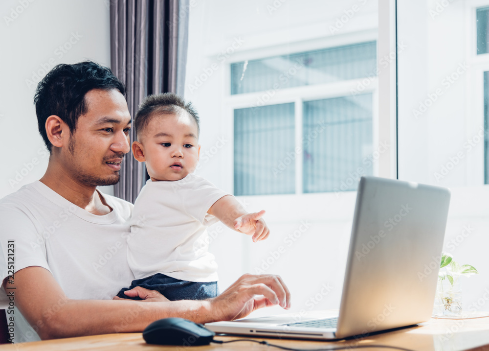 Man father using working on laptop computer Man father using working on laptop computer