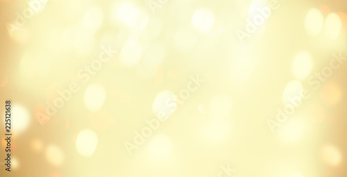 Golden Christmas bokeh background with snowflake and gold glittering bokeh stars. A shiny holiday card. Abstract Glowing blurred lights