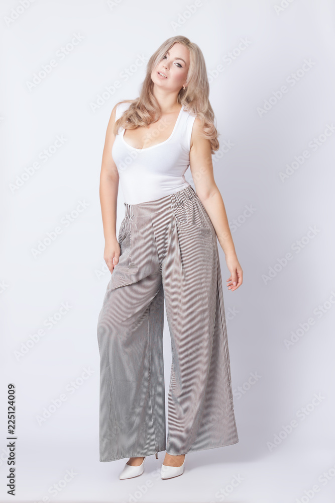 Full length portrait of cheerful blonde woman Full length portrait of cheerful blonde woman