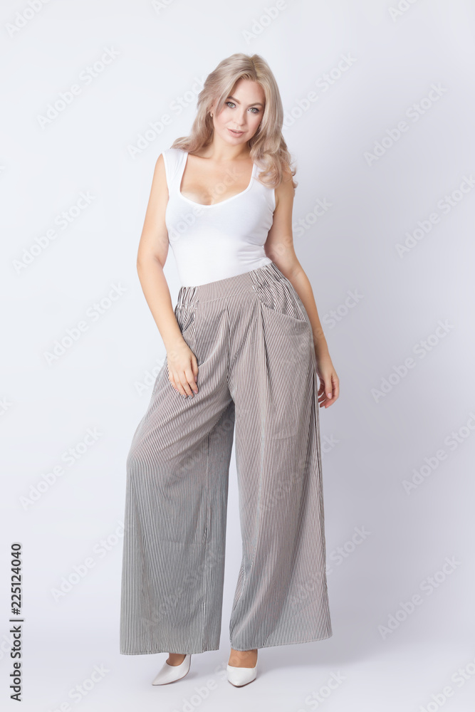 Full length portrait of cheerful blonde woman Full length portrait of cheerful blonde woman