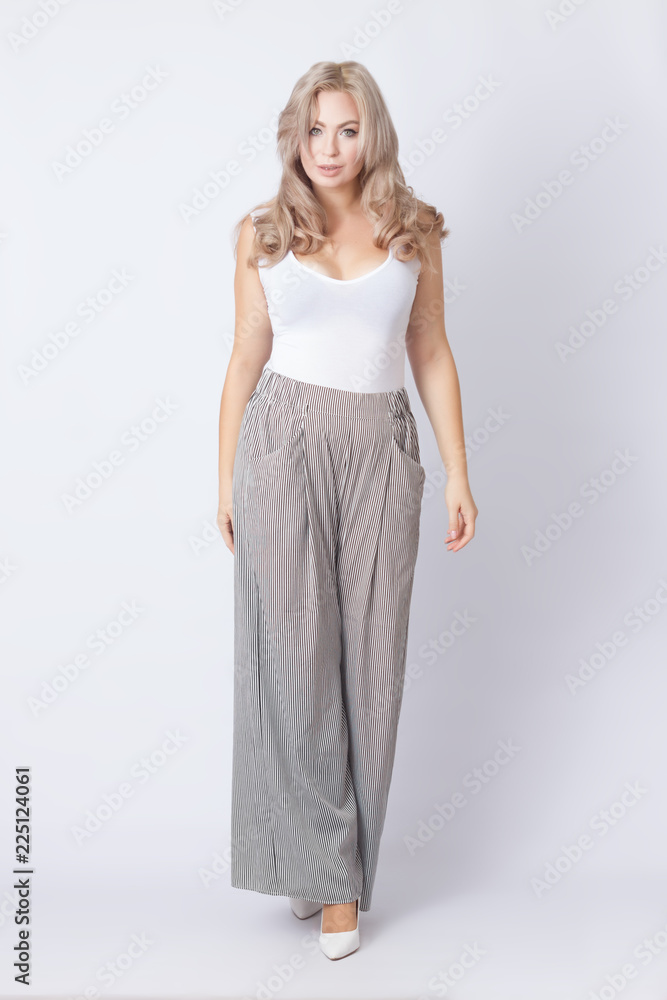 Full length portrait of cheerful blonde woman Full length portrait of cheerful blonde woman