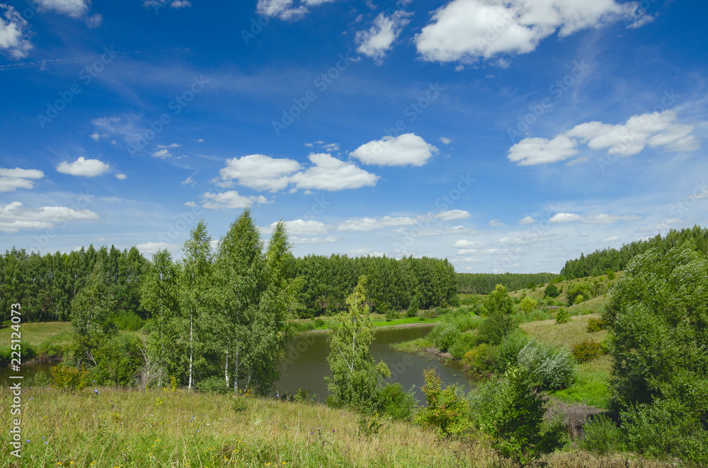 Sunny summer landscape with green hills,river curve and beautiful woods on a nice day.Tula region,Russia Sunny summer landscape with green hills,river curve and beautiful woods on a nice day.Tula region,Russia