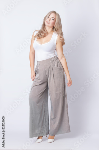 Full length portrait of cheerful blonde woman