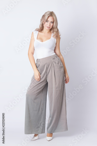 Full length portrait of cheerful blonde woman