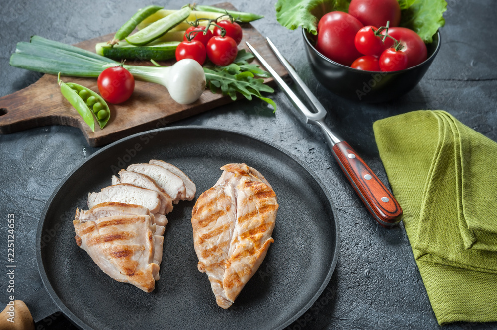 Grilled chicken fillet on frying pan Grilled chicken fillet on frying pan