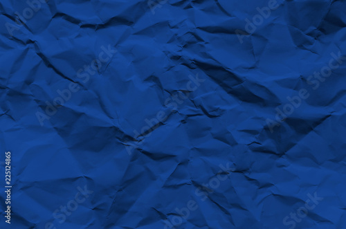 Deep Blue and vintage background by crumpled paper texture and free space for text.