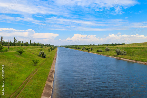 View on the irrigation canal on summer © olyasolodenko