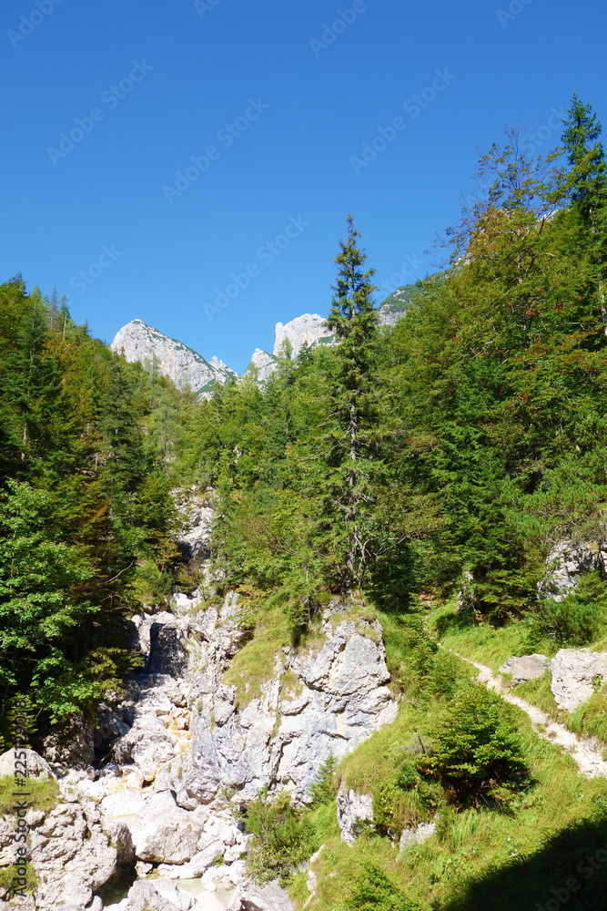 Hiking trail leading from Lago del Predil to Bivacco Gorizia and Cima delle Forcelle in Dolomites, Alps, Italy Hiking trail leading from Lago del Predil to Bivacco Gorizia and Cima delle Forcelle in Dolomites, Alps, Italy