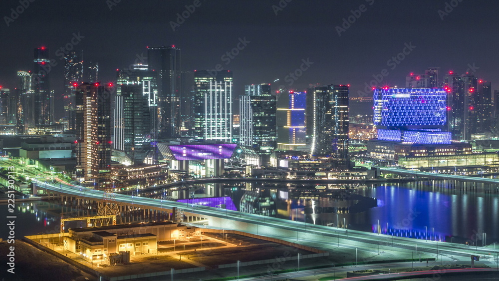 Aerial skyline of Abu Dhabi city centre from above night timelapse