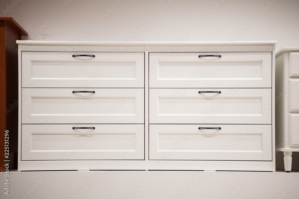 Wooden white dresser. Modern chest of drawers Wooden white dresser. Modern chest of drawers