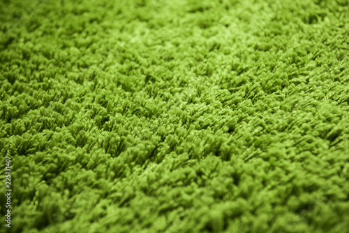 Canvas Print Close up of green yarn carpet for background