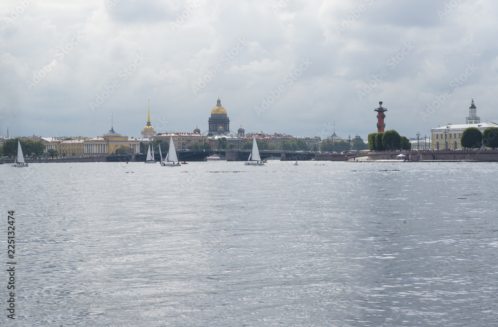 view of St. Petersburg, yachts on the Neva, the Dome of St. Isaac's Cathedral, Neva river, Admiralty spire, Rostral column