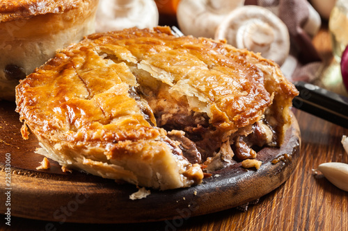 Tableau sur toile Fresh beef stew pie on a cutting board